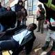 St. Louis Post-Dispatch reporter Koran Addo lays on the ground as he receives aid after being hit in the face with pepper spray on Dec. 31. He was covering a protest outside the St. Louis Police headquarters.
David Carson/Post-Dispatch